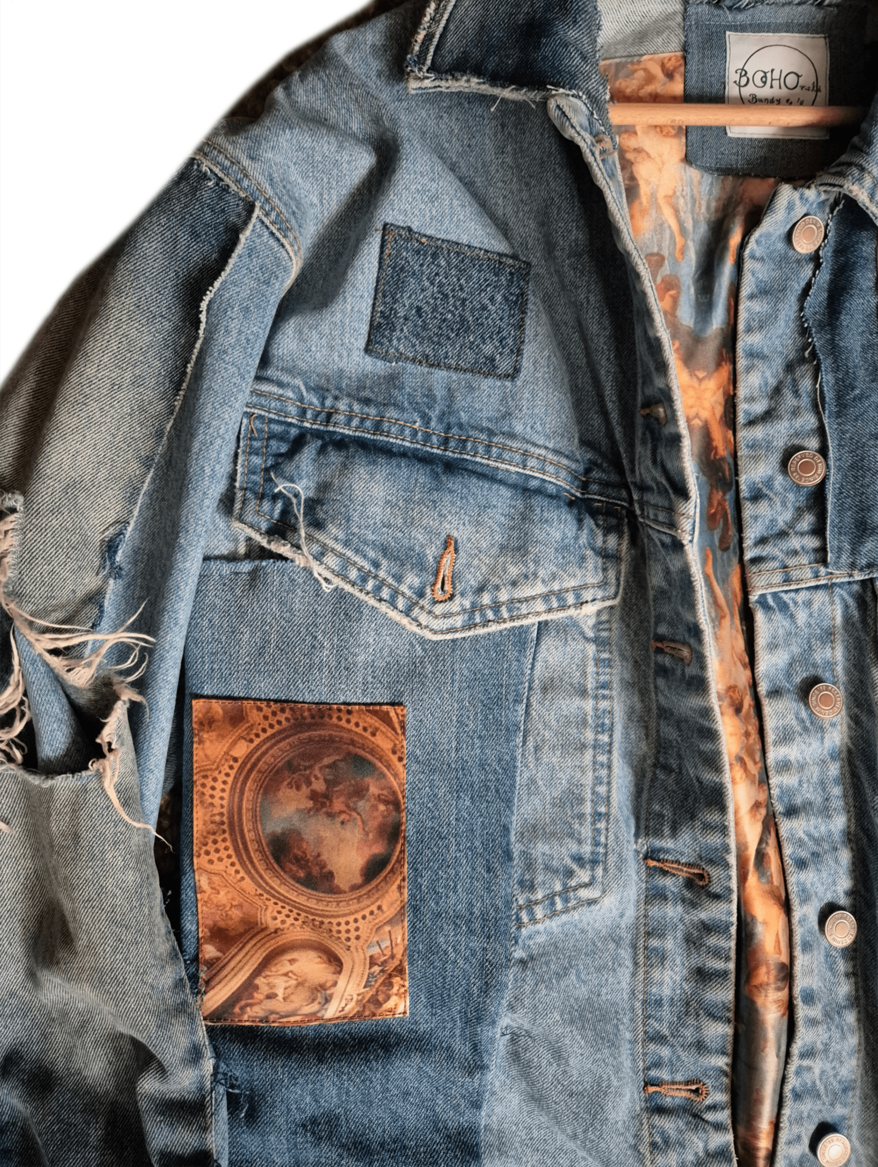 Custom embroidered denim jacket with bohemian patches